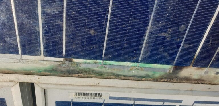 A solar panel with rust on it.