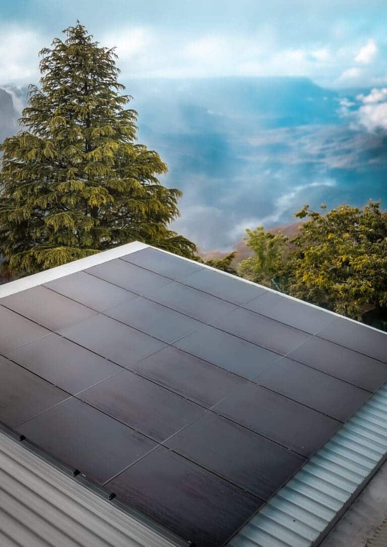 A solar panel on the roof of a house.