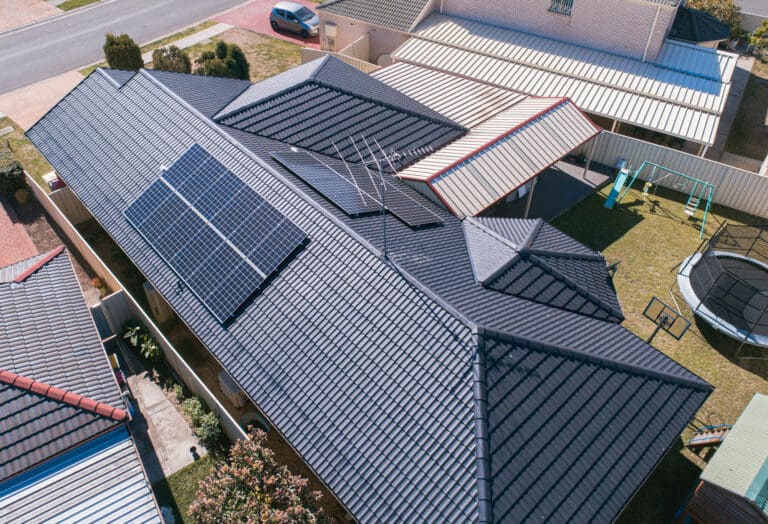 An aerial view of a roof with solar panels.