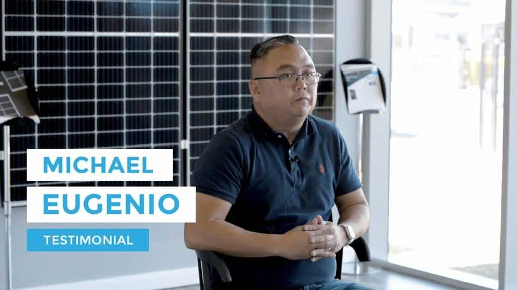 Michael eugenio's testimonial in front of solar panels.