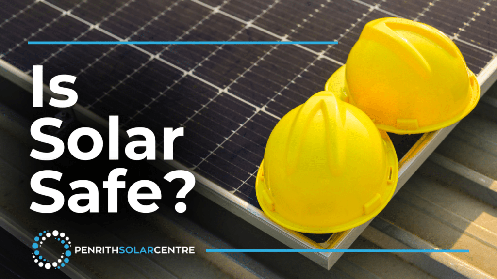 Two yellow safety helmets placed on solar panels with text "is solar safe?" and the logo of penrith solar centre.