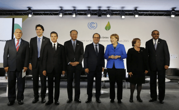 World leaders standing together at the 2015 united nations climate change conference in paris.