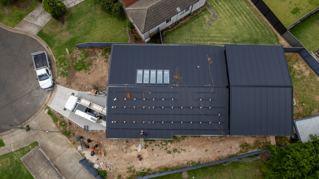 An aerial view of a house with solar mounting system.