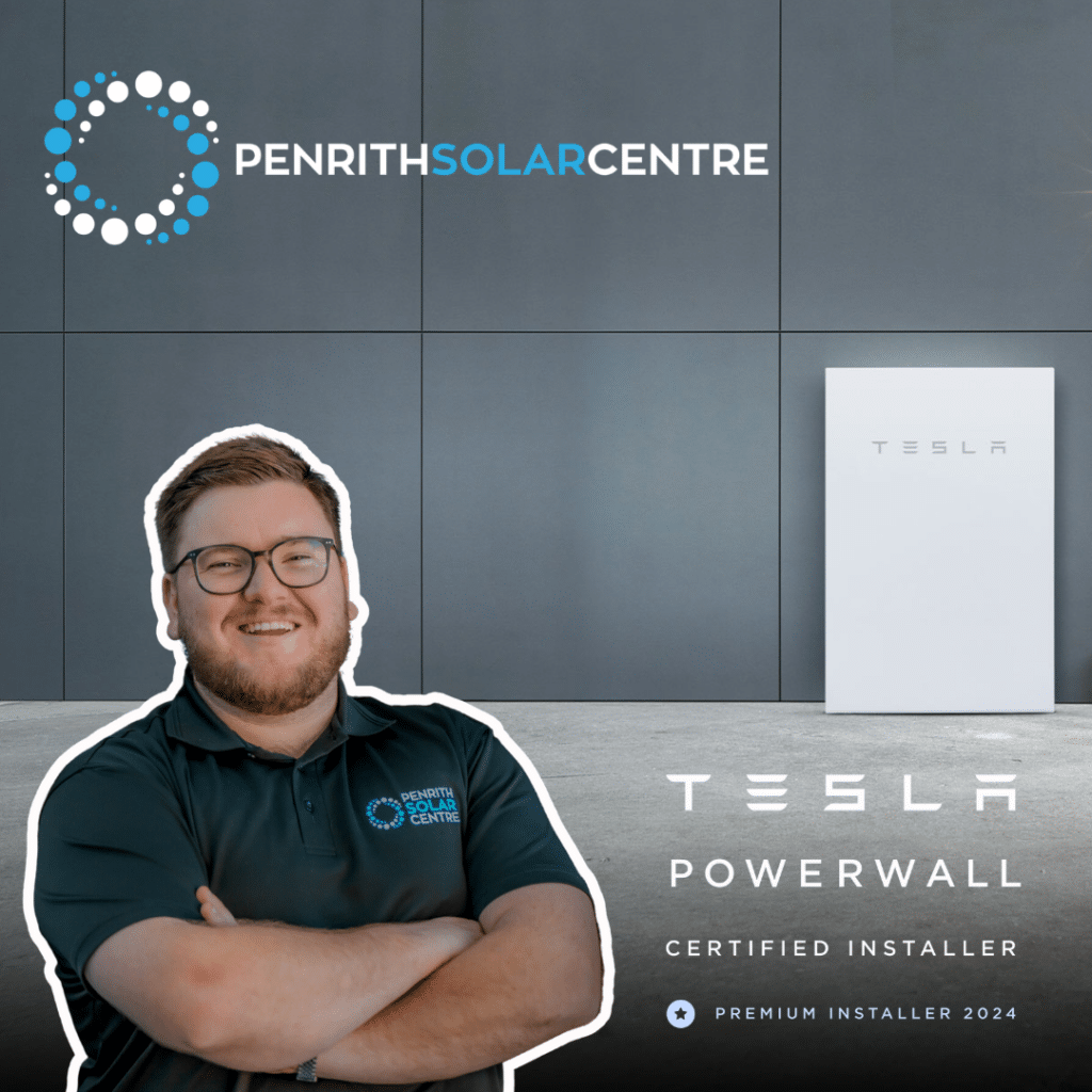 A man standing in front of a tesla powerwall.